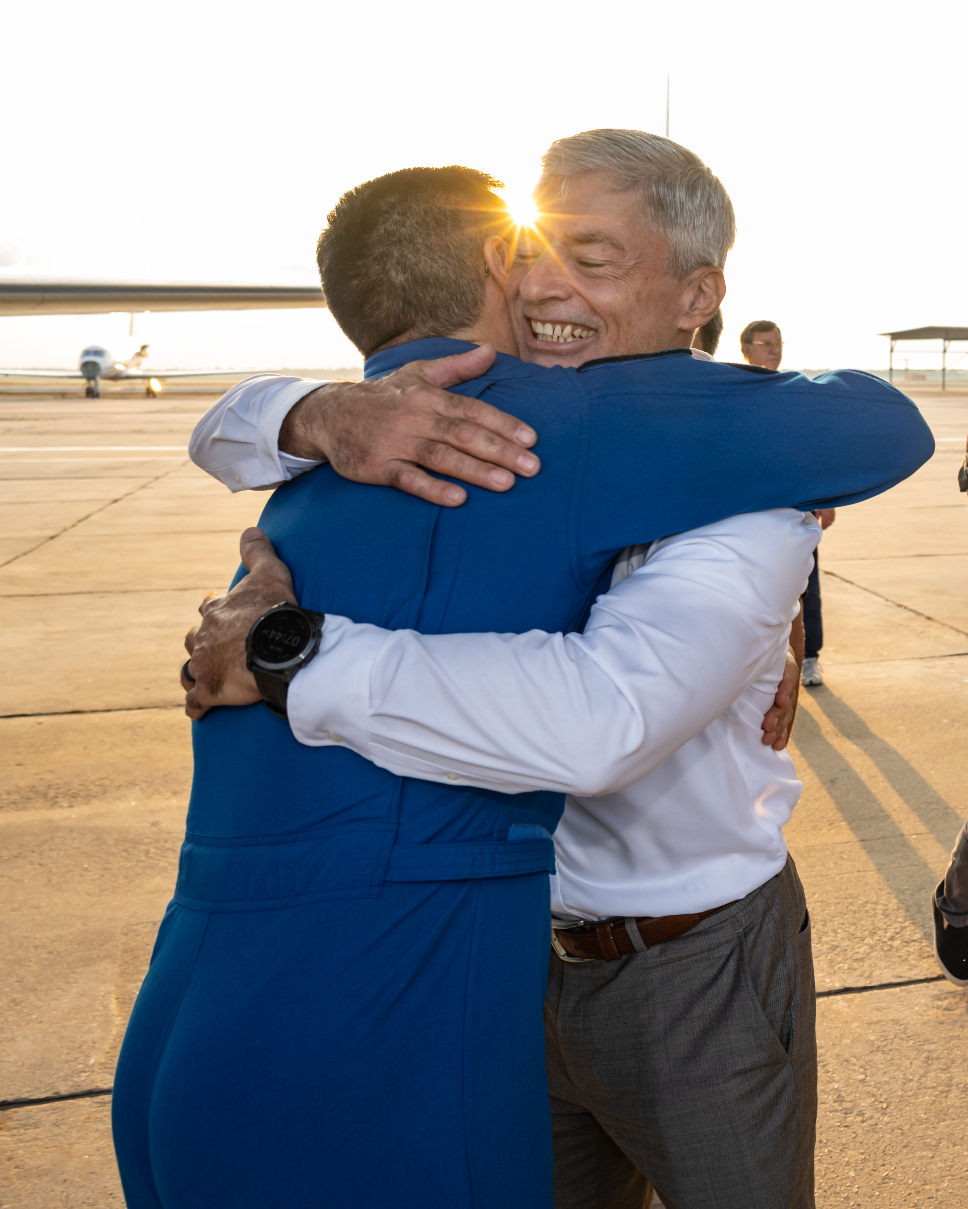 NASA astronaut Frank Rubio is greeted by fellow NASA astronaut Mark Vande Hei following his arrival at Ellington Field in Houston, Texas, aboard a NASA jet. Rubio had just completed a 371-day mission aboard the International Space Station the day before, breaking Vande Hei's previous single spaceflight record of 355 days set back on March 30, 2022.