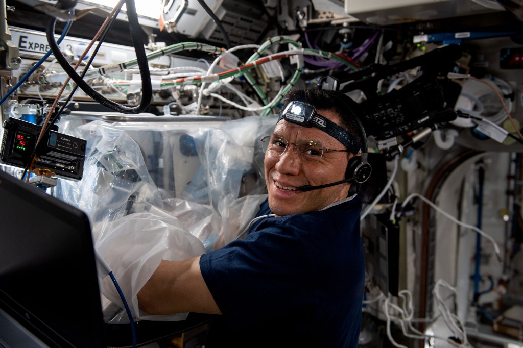 NASA astronaut and Expedition 69 Flight Engineer Frank Rubio uses a glovebag to perform research activities inside the Columbus laboratory module's BioFabrication Facility (BFF). The BFF is a research platform to print organ-like tissues and begin proving the viability of fabricating human organs in space.