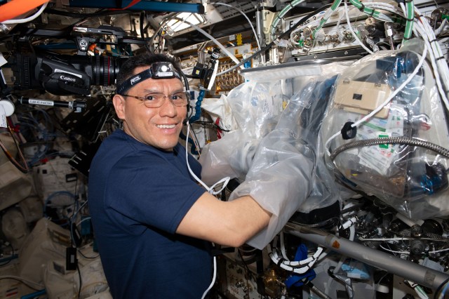 NASA astronaut and Expedition 70 Flight Engineer Frank Rubio uses a glovebag and services the BioFabrication Facility, replacing and installing components inside the research device designed to print organ-like tissues in microgravity and learn how to manufacture whole, fully-functioning human organs in space.
