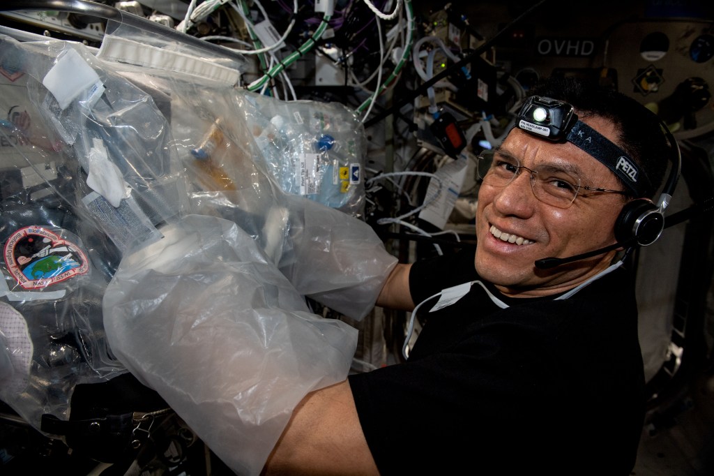 NASA astronaut and Expedition 69 Flight Engineer Frank Rubio uses a glovebag and services the BioFabrication Facility, replacing and installing components inside the research device designed to print organ-like tissues in microgravity and learn how to manufacture whole, fully-functioning human organs in space.