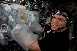 NASA astronaut and Expedition 69 Flight Engineer Frank Rubio uses a glovebag and services the BioFabrication Facility, replacing and installing components inside the research device designed to print organ-like tissues in microgravity and learn how to manufacture whole, fully-functioning human organs in space.