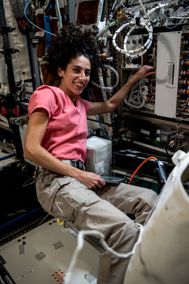 NASA astronaut and Expedition 70 Flight Engineer Jasmin Moghbeli is pictured removing and replacing components inside the Cold Atom Lab aboard the International Space Station. The space physics device enables observations of atoms chilled to temperatures near absolute zero allowing scientists to study fundamental behaviors and quantum characteristics not possible on Earth.