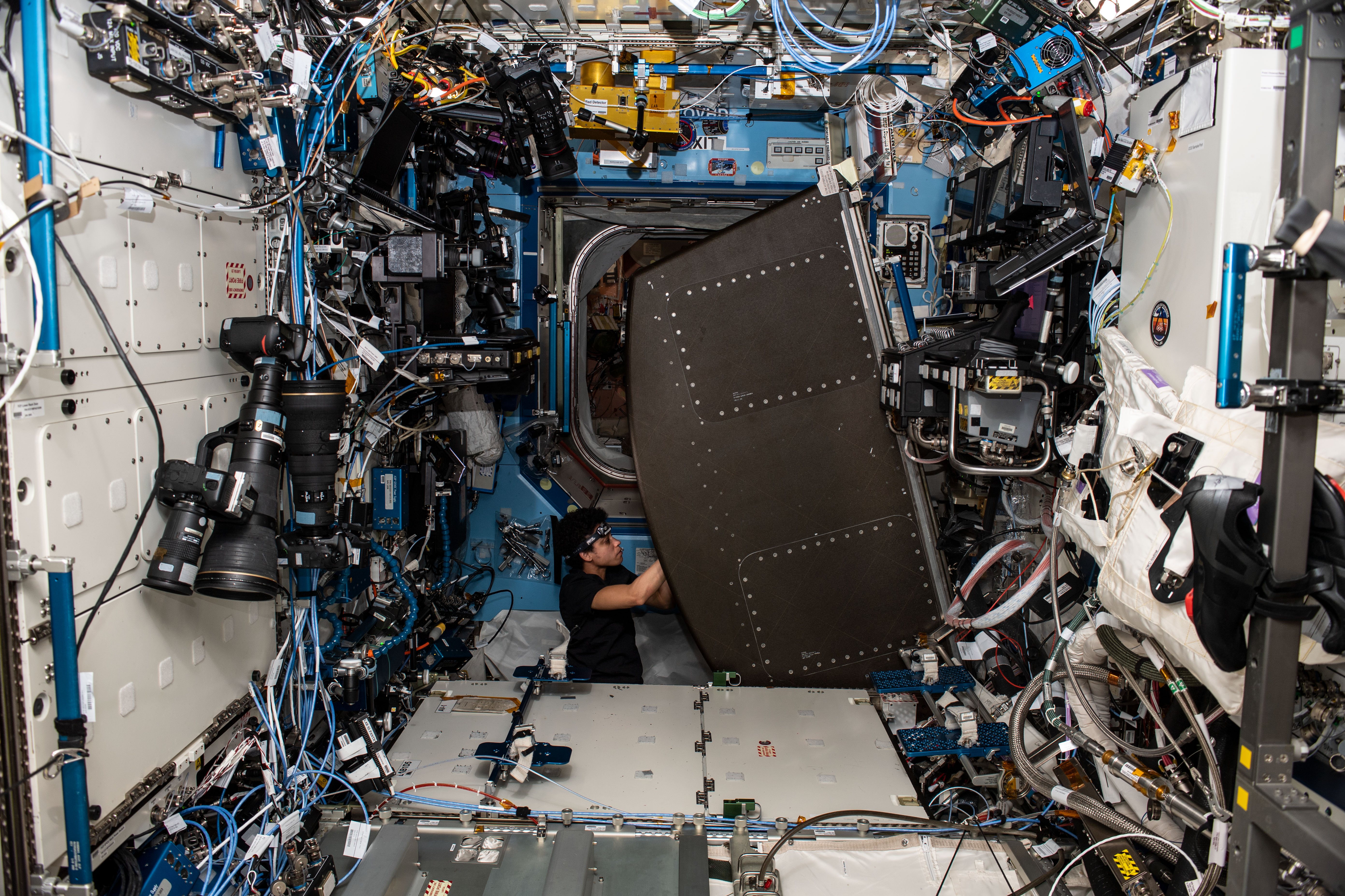 Expedition 67 Flight Engineer and NASA astronaut Jessica Watkins replaces components on the Major Constituents Analyzer (MCA) in the U.S. Destiny laboratory module's Avionic Rack. The MCA is a life support device ensures oxygen and carbon dioxide levels remain safe aboard the International Space Station.