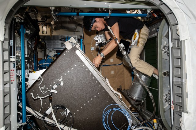 NASA astronaut and Expedition 67 Flight Engineer Jessica Watkins services life support components inside the Tranquility module's Water Recovery System rack abaord the International Space Station.