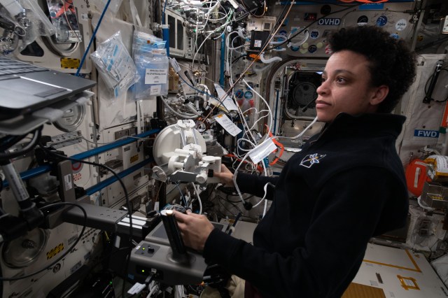 NASA astronaut and Expedition 67 Flight Engineer Jessica Watkins works on the Surface Avatar laptop computer in the Columbus laboratory module to study ways, such as haptic controls, user interfaces, and virtual reality, to command and control surface-bound robots from space.