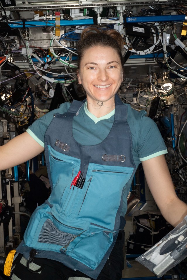 NASA astronaut and Expedition 67 Flight Engineer Kayla Barron poses for a portrait during maintenance work aboard the International Space Station.