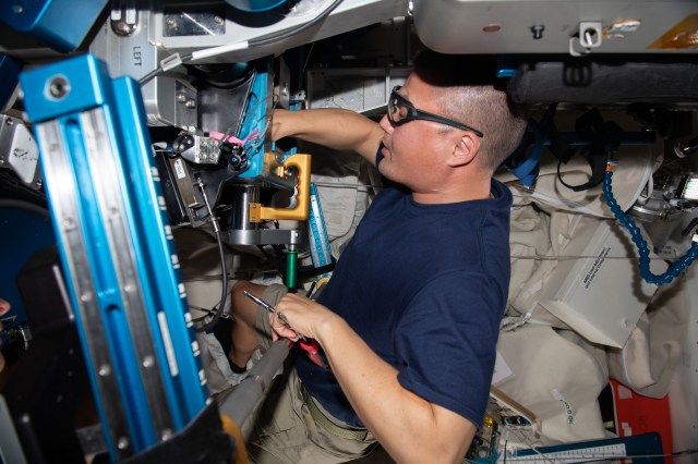 Expedition 67 Flight Engineer and NASA astronaut Kjell Lindgren replaces components on the advanced resistive exercise device (ARED) located inside the International Space Station's Tranquility module. The ARED mimics the inertial forces generated when lifting free weights on Earth allowing astronauts to maintain muscle strength and mass during long-term space missions.