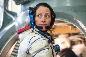 NASA astronaut Loral O'Hara prepares to enter a Soyuz spacecraft simulator in her Sokol launch and entry suit for preflight training before beginning her mission to the International Space Station.