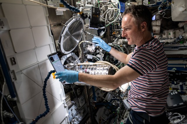ESA (European Space Agency) astronaut and Expedition 67 Flight Engineer Matthias Maurer performs maintenance on combustion research hardware aboard the International Space Station.