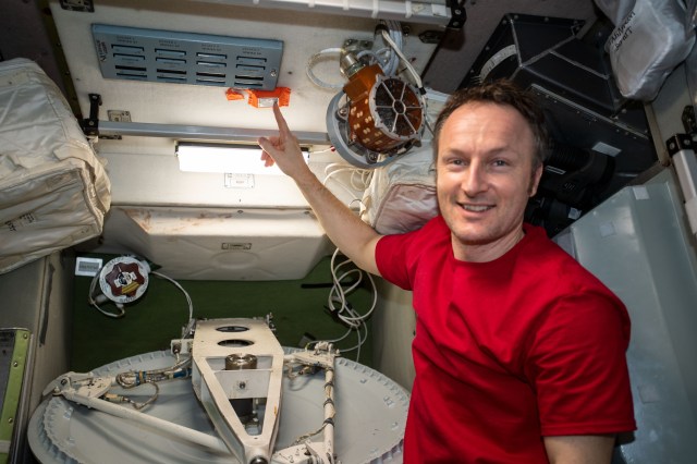 ESA (European Space Agency) astronaut and Expedition 67 Flight Engineer Matthias Maurer relocates a passive radiation monitor inside the International Space Station's Zvezda service module.