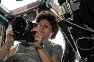 ESA (European Space Agency) astronaut and Expedition 67 Flight Engineer Samantha Cristoforetti checks out a camera inside the International Space Station's "window to the world," the seven-windowed cupola.