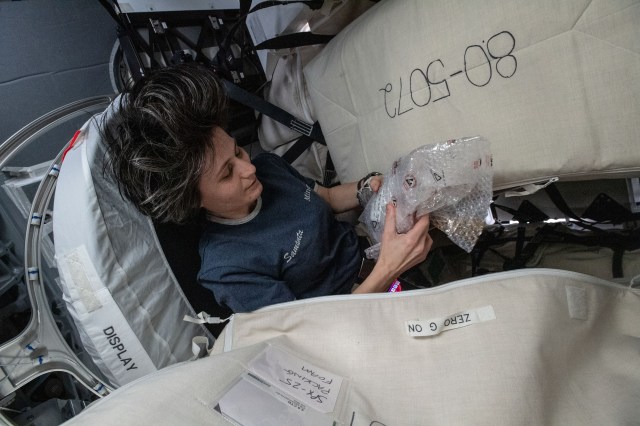 ESA (European Space Agency) astronaut and Expedition 67 Flight Engineer Samantha Cristoforetti is pictured packing cargo inside the SpaceX Dragon resupply ship before it undocked from the International Space Station on Aug. 19, 2022.