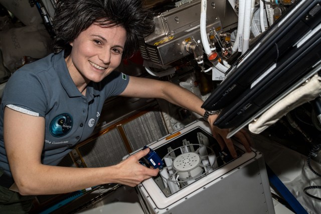 Expedition 67 Flight Engineer and ESA (European Space Agency) astronaut Samantha Cristoforetti packs experiment containers for the Biofilms investigation aboard the International Space Station. The biotechnology study explores ways to protect astronaut health and maintain spacecraft safety from microbes living in the orbiting's lab environment.