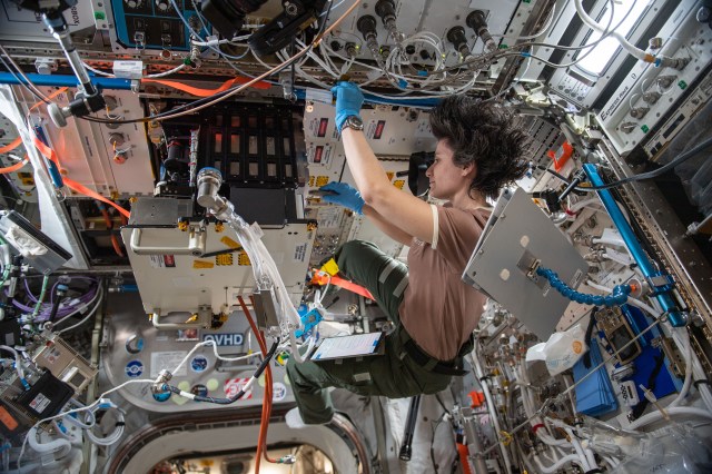 ESA (European Space Agency) astronaut and Expedition 67 Flight Engineer Samantha Cristoforetti swaps samples inside the Fluid Science Laboratory’s Soft Matter Dynamics experiment container. The space physics study takes place aboard the International Space Station's Columbus laboratory module and explores the dynamics of foams, droplets, and granular materials with implications for future planetary travel and industries on Earth.