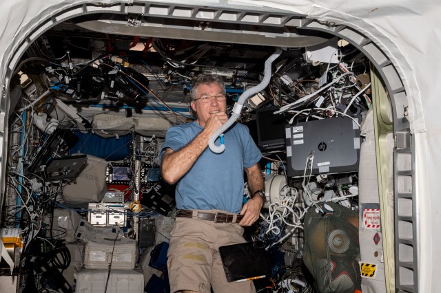 NASA astronaut and Expedition 69 Flight Engineer Stephen Bowen is pictured in the Columbus laboratory module conducting a HAM radio session with students from Carleton University in Ottawa, Ontario, in Canada.