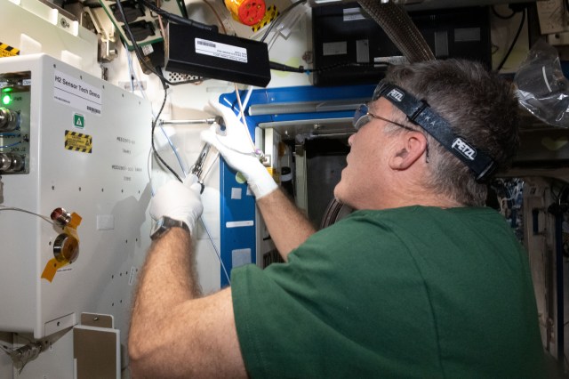 NASA astronaut and Expedition 69 Flight Engineer Stephen Bowen installs the Advanced Hydrogen Sensor Technology Demonstration (OGA H2 Sensor Demo) on the Destiny laboratory module's Oxygen Generation System rack aboard the International Space Station. The device is testing new sensors to promote a longer operational life inside advanced oxygen generation systems for future space exploration missions.