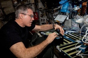 NASA astronaut and Expedition 69 Flight Engineer Stephen Bowen works on space biology research hardware located inside the International Space Station's Kibo laboratory module.