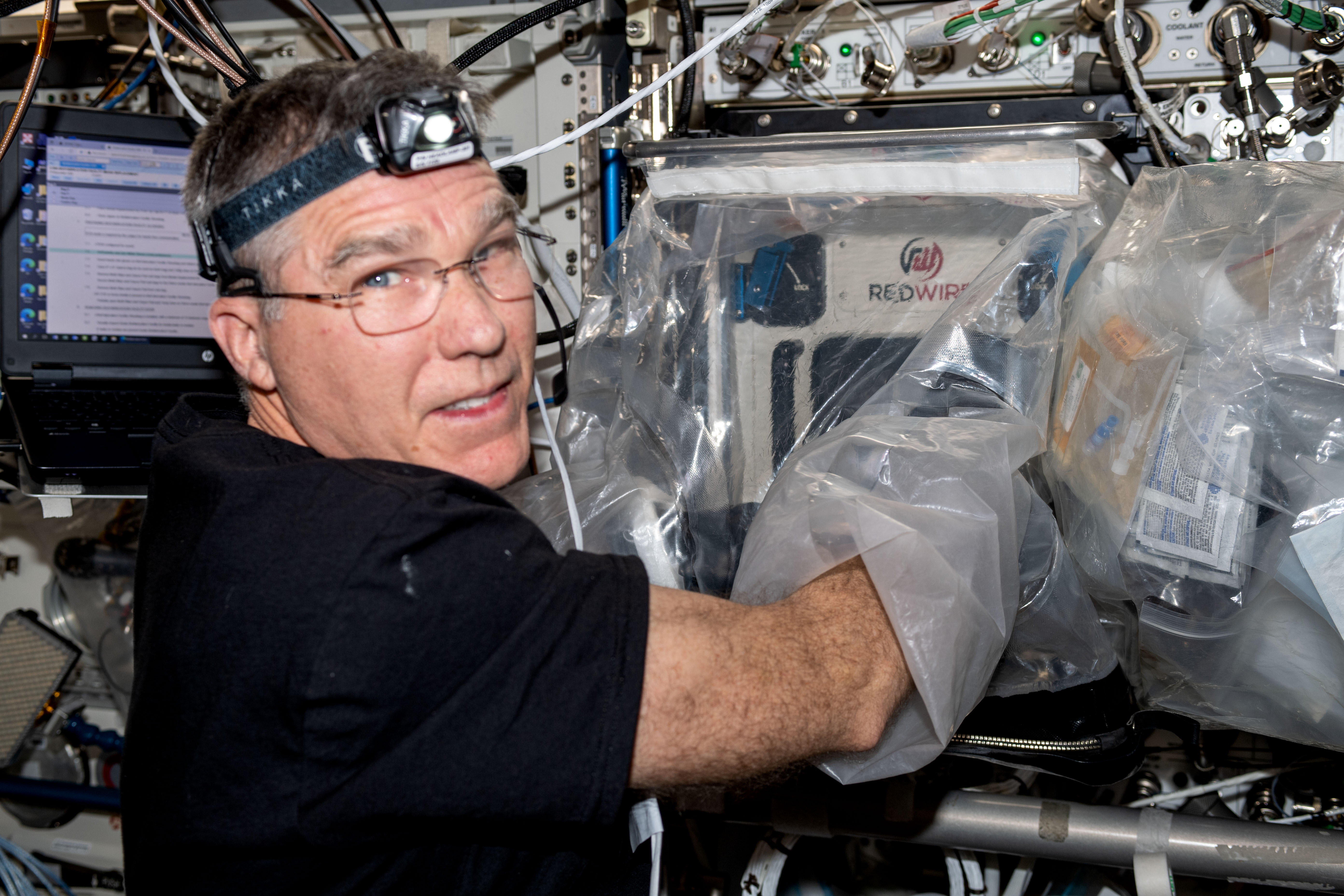 NASA astronaut Stephen Bowen works with the BioFabrication Facility which uses 3D printers to investigate the feasibility of printing organ-like tissues in microgravity.
