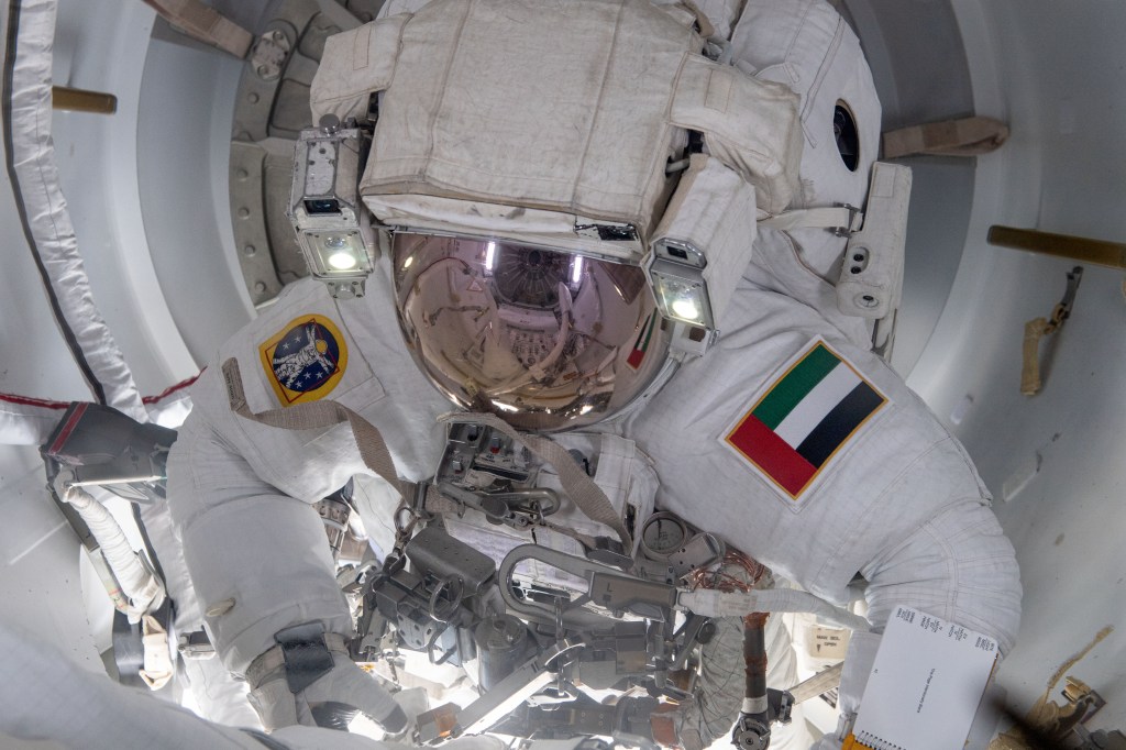 UAE (United Arab Emirates) astronaut and Expedition 69 Flight Engineer Sultan Alneyadi is pictured in his Extravehicular Mobility Unit, or spacesuit, preparing to exit the International Space Station's Quest airlock and begin his first spacewalk. He and NASA astronaut Stephen Bowen (out of frame) would spend seven hours and one minute in the vacuum of space routing cables and installing insulation readying the orbital outpost for its next set of roll-out solar arrays due to be installed after their delivery on the next SpaceX Dragon cargo mission.