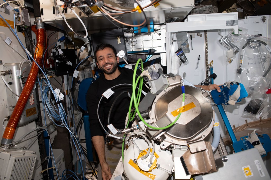 UAE (United Arab Emirates) astronaut and Expedition 69 Flight Engineer Sultan Alneyadi replaces orbital plumbing components in the International Space Station's bathroom, or Waste and Hygiene Compartment, located in the Tranquility module.