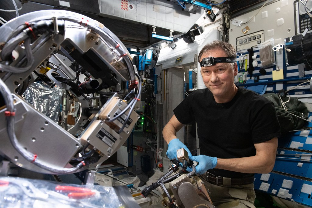 NASA astronaut and Expedition 67 Commander Thomas Marshburn configures the Combustion Integrated Rack's combustion chamber for the Solid Fuel Ignition and Extinction study to investigate material flammability and ways to improve fire safety in space.