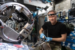 NASA astronaut and Expedition 67 Commander Thomas Marshburn configures the Combustion Integrated Rack's combustion chamber for the Solid Fuel Ignition and Extinction study to investigate material flammability and ways to improve fire safety in space.