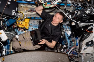 NASA astronaut and Expedition 69 Flight Engineer Woody Hoburg is pictured inside the Destiny laboratory module installing electronics and communications hardware.