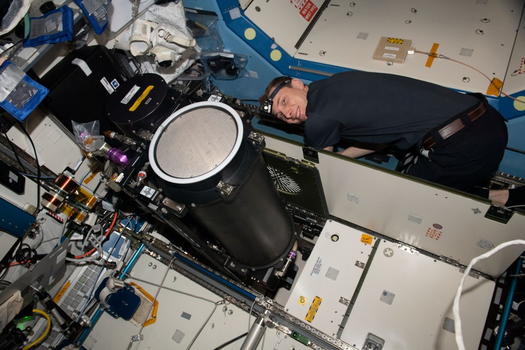 NASA astronaut and Expedition 69 Flight Engineer Woody Hoburg works inside the International Space Station's Destiny laboratory module and replaces life support system components.