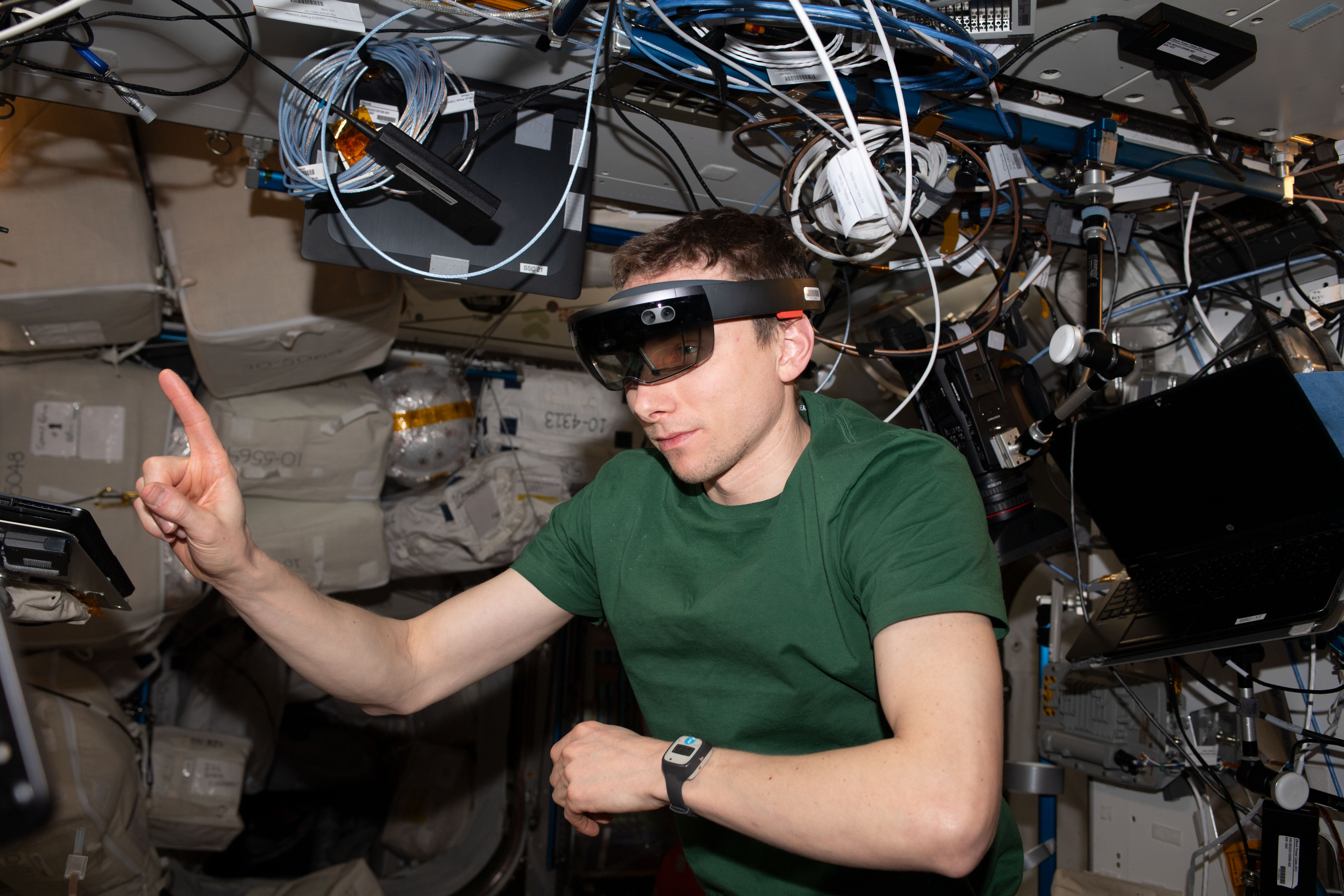 NASA astronaut and Expedition 69 Flight Engineer Woody Hoburg tests the ability to use augmented reality goggles for maintenance aboard the International Space Station.