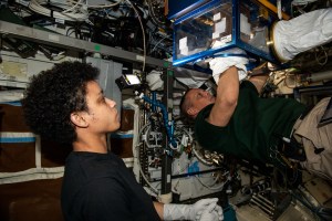 NASA's Expedition 67 Flight Engineers Jessica Watkins and Bob Hines transport research gear and samples from the SpaceX Dragon resupply ship into the U.S. Destiny laboratory module. The duo then activated an experiment to explore how microgravity affects the skin healing process.