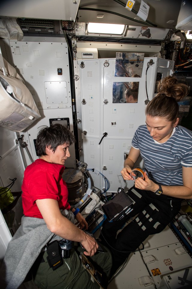 Expedition 67 Flight Engineers (from left) Samantha Cristoforetti of ESA (European Space Agency) and Kayla Barron of NASA partner together for maintenance activities aboard the International Space Station's Tranquility module.