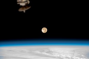 The second full Moon in August, both a Blue Moon and supermoon, glows brightly over Earth as the International Space Station orbited 260 miles above the Pacific Ocean.