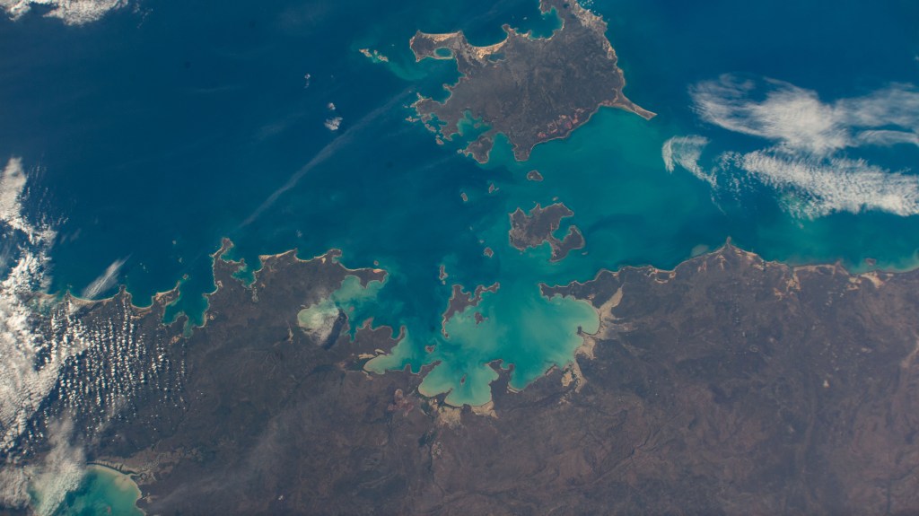 Australia's island of Anindilyakwa (surrounded by several smaller islands), just off the coast of the nation's Northern Territory, in the Gulf of Carpenteria is pictured from the International Space Station as it orbited 261 miles above the island continent.