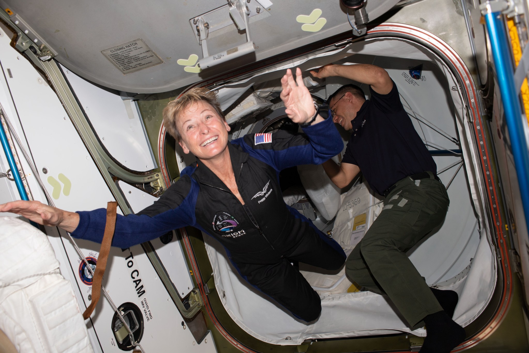Axiom Space private astronaut and Axiom Mission-2 Commander Peggy Whitson enters the International Space Station shortly after the hatches were opened between the orbital outpost and the SpaceX Dragon Freedom spacecraft. Welcoming her inside the vestibule between the station's Harmony module and Dragon is NASA astronaut and Expedition 69 Flight Engineer Frank Rubio.