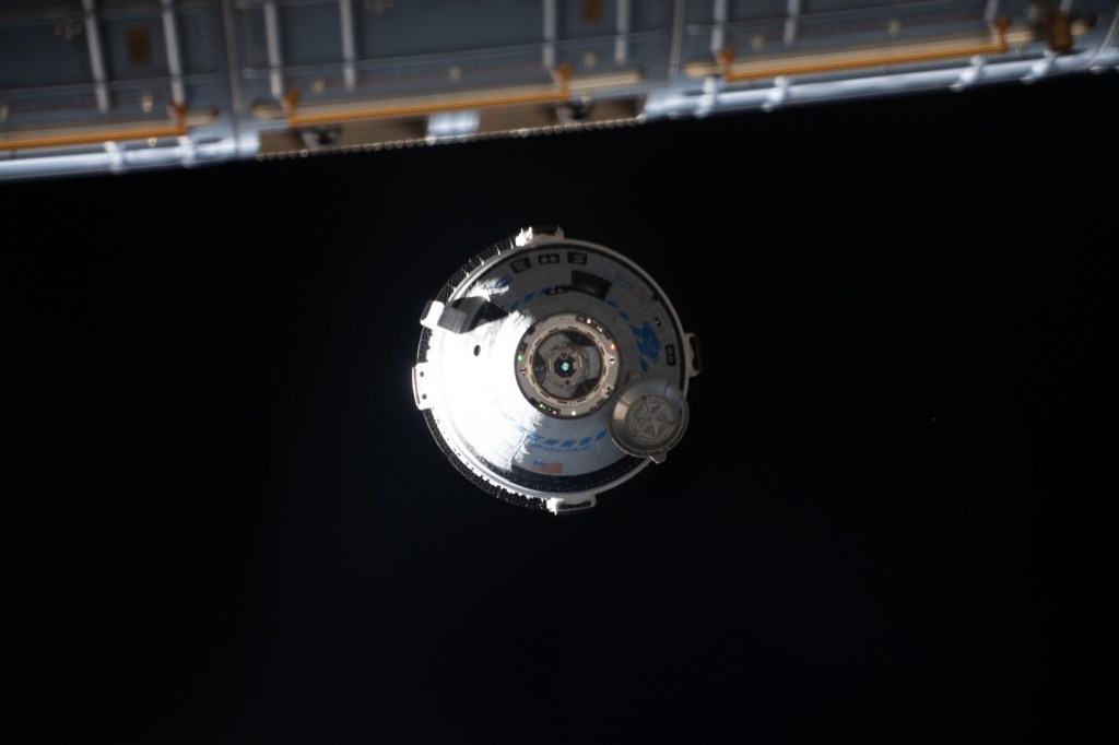 Boeing's CST-100 Starliner crew ship approaches the International Space Station on the company's Orbital Flight Test-2 mission before automatically docking to the Harmony module's forward port.