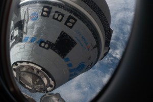 This view from a window on the SpaceX Crew Dragon Freedom crew ship shows Boeing's CST-100 Starliner crew ship moments away from docking to the Harmony module's forward port on the International Space Station for the company's Orbital Flight Test-2 mission.