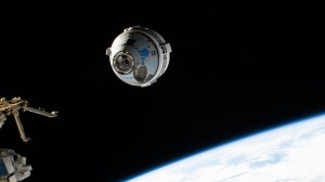 Boeing's CST-100 Starliner crew ship approaches the International Space Station on the company's Orbital Flight Test-2 mission before automatically docking to the Harmony module's forward port. The orbiting lab was flying 271 miles above the south Pacific off the coast of New Zealand at the time of this photograph.