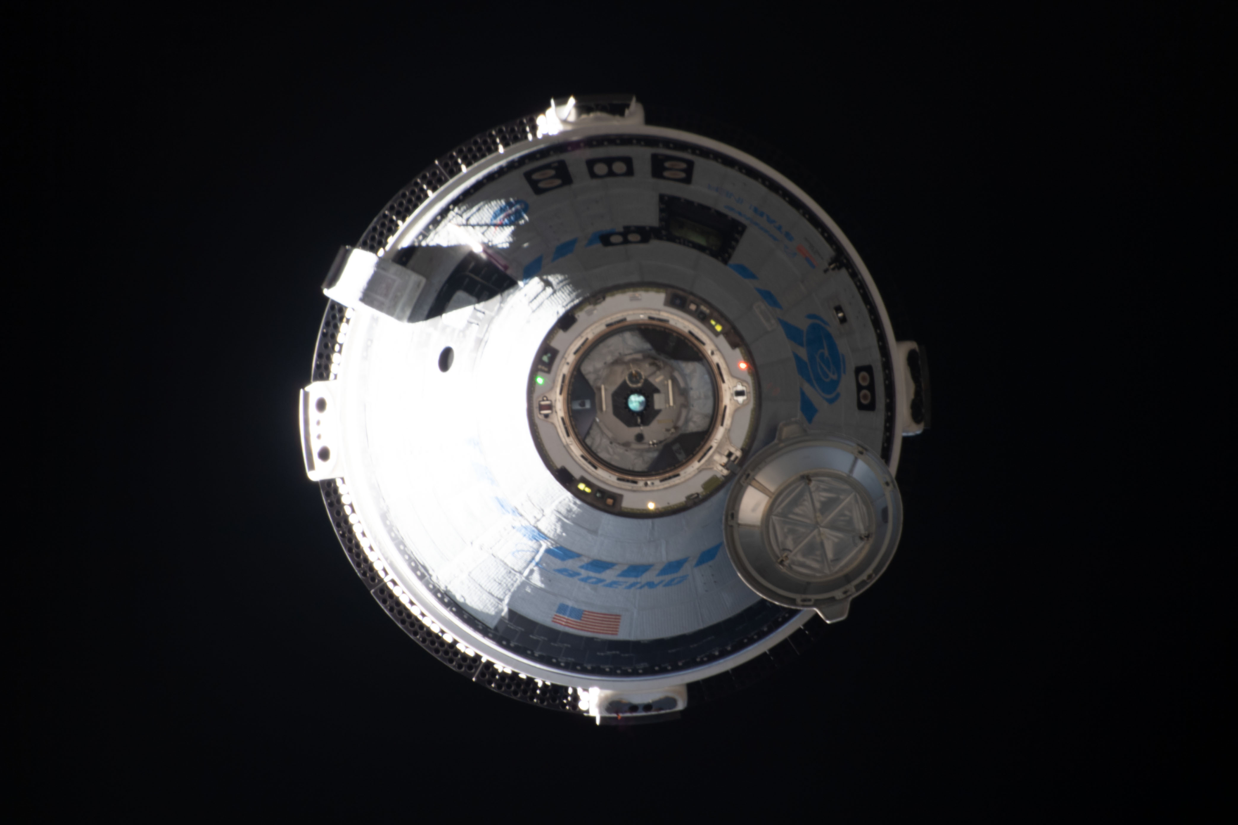 Boeing's CST-100 Starliner crew ship approaches the International Space Station on the company's Orbital Flight Test-2 mission before automatically docking to the Harmony module's forward port.
