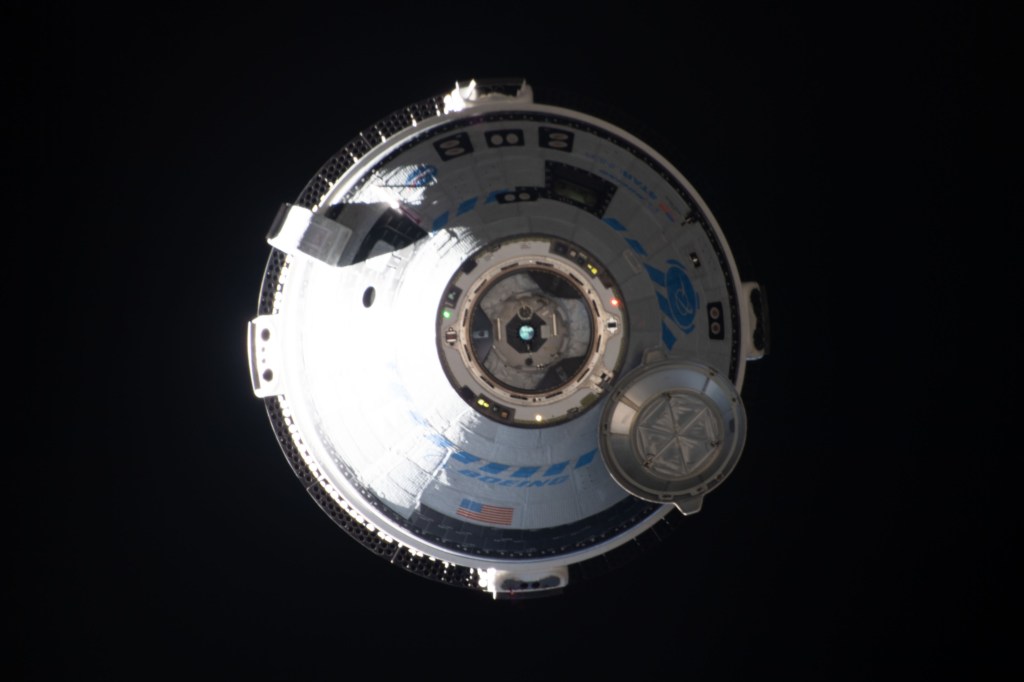 Boeing's CST-100 Starliner crew ship approaches the International Space Station on the company's Orbital Flight Test-2 mission before automatically docking to the Harmony module's forward port.