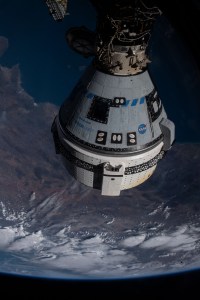 Boeing's CST-100 Starliner crew ship is pictured docked to the Harmony module's forward port on the International Space Station as the orbitng complex flew 261 miles above the Pacific Ocean off the coast of Mexican state of Nayarit.
