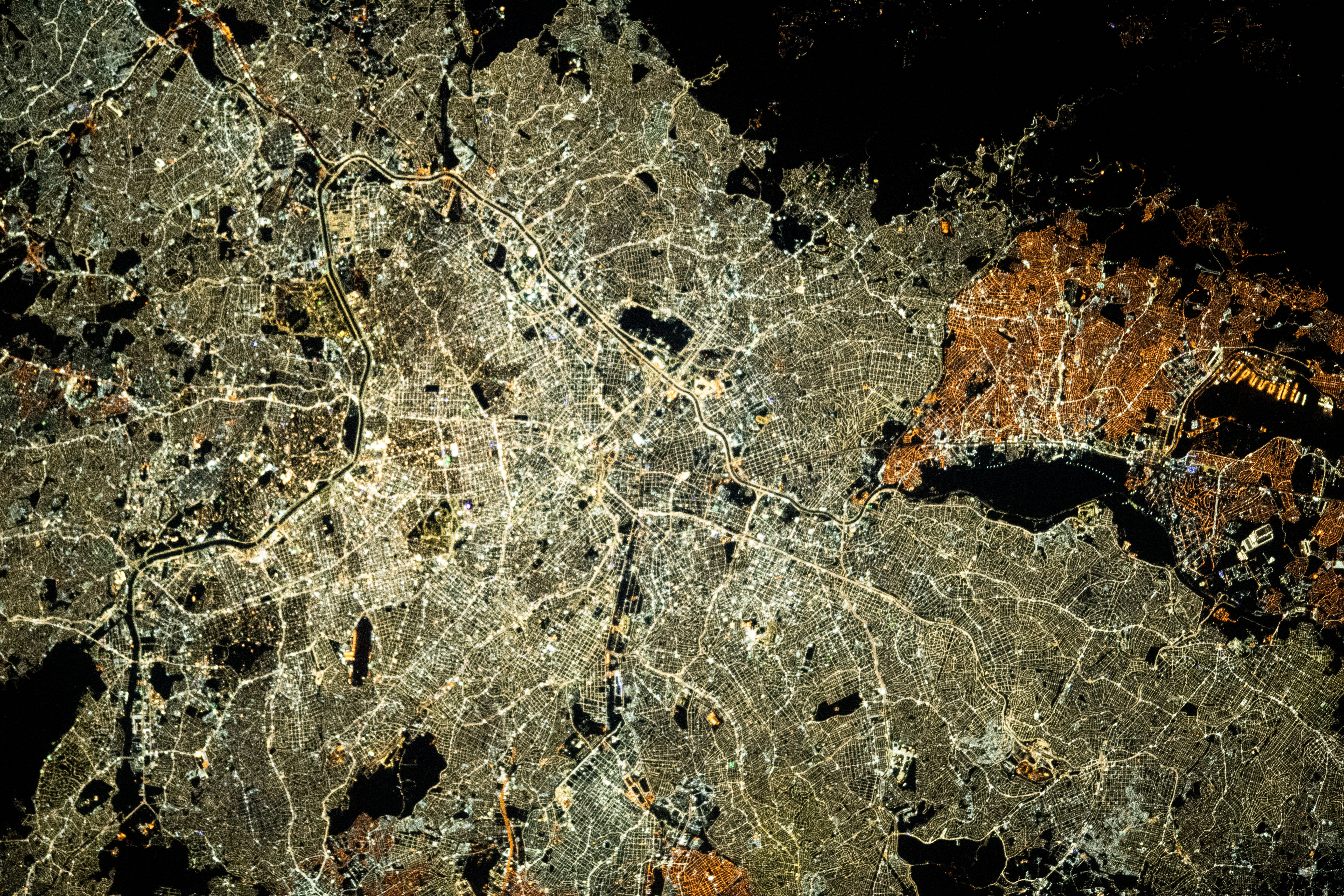 São Paulo, the most populous city in Brazil, can be differentiated by its bright street lights versus the darker street lights in the smaller city of Guarulhos (at right) in this picture from the International Space Station as it orbited 261 miles above.