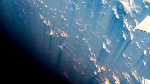 Light pink-orange and white clouds scatter across the blue waters of the Atlantic Ocean as the International Space Station orbited 260 miles above.
