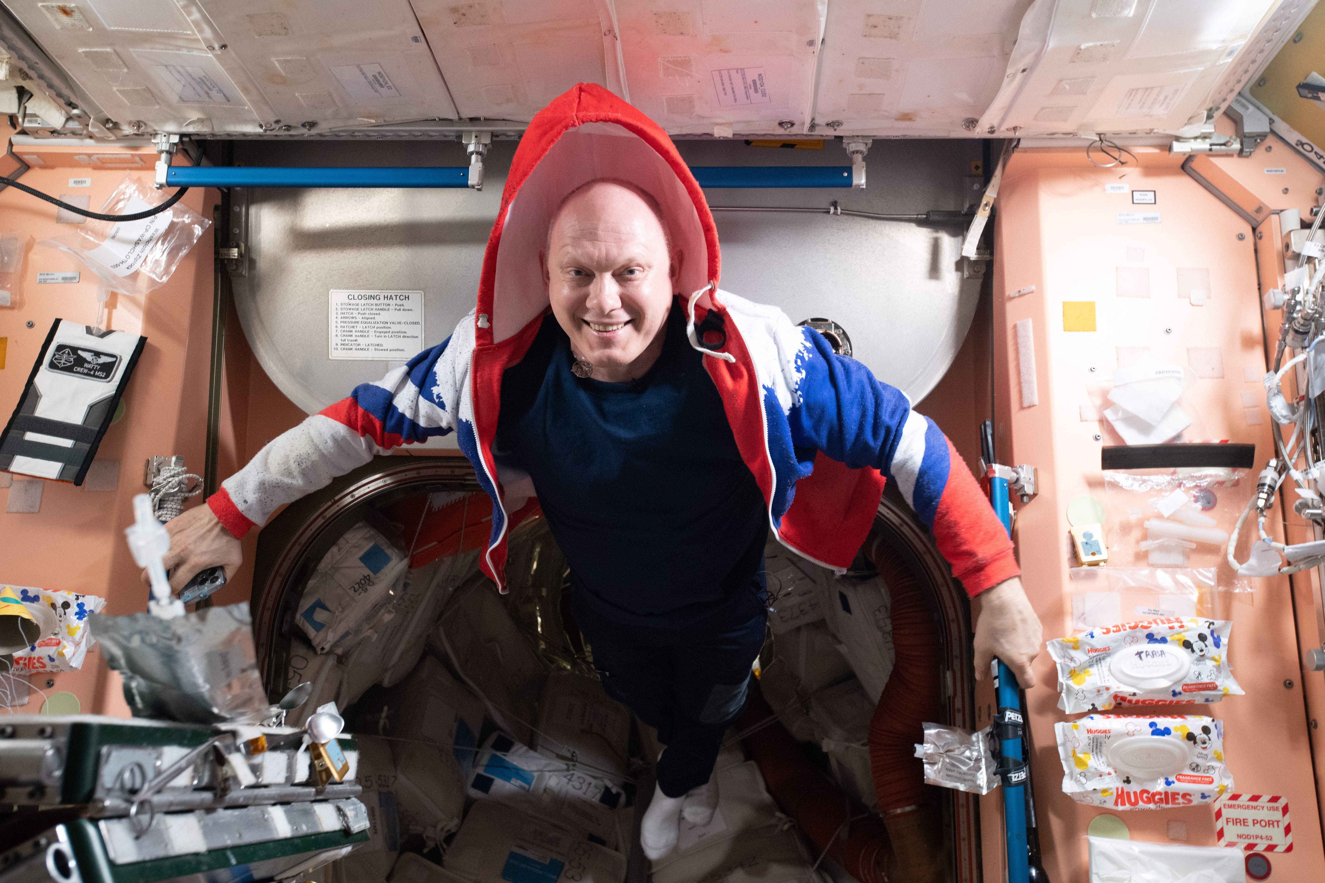 Roscosmos cosmonaut and Expedition 67 Commander Oleg Artemyev smiles for a portrait inside the International Space Station's Unity module.