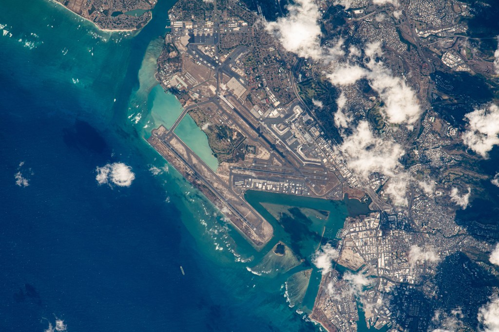 The Daniel K. Inouye International Airport (Honolulu International Airport) pictured as the International Space Station orbited roughly 260 miles above the coasts of Hawaii. The airport is the largest in Hawaii, located on the island of O'ahu.