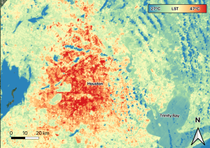 In the center of the image, the city of Houston is dark red. A thin orange color, indication cooler areas, surrounds the red areas. There is a wide band of yellow, then a band of light green, and a few blue areas along the edges of the image, which correspond to the coolest land surface temperature.