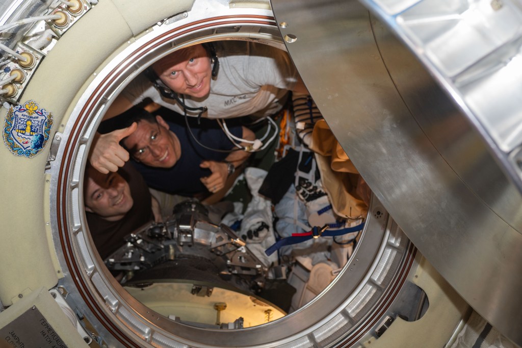 Three Expedition 69 crew members are pictured inside the Soyuz MS-23 crew ship that would return the trio back to Earth after living and working for 371 days aboard the International Space Station. From left are, Roscosmos cosmonaut Dmitri Petelin, NASA astronaut Frank Rubio, and Roscosmos cosmonaut Sergey Prokopyev.