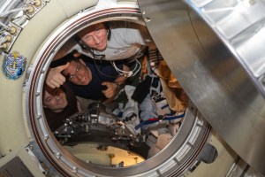 Three Expedition 69 crew members are pictured inside the Soyuz MS-23 crew ship that would return the trio back to Earth after living and working for 371 days aboard the International Space Station. From left are, Roscosmos cosmonaut Dmitri Petelin, NASA astronaut Frank Rubio, and Roscosmos cosmonaut Sergey Prokopyev.