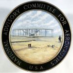 Seal of NACA, including an illustration of the first flight at Kitty Hawk