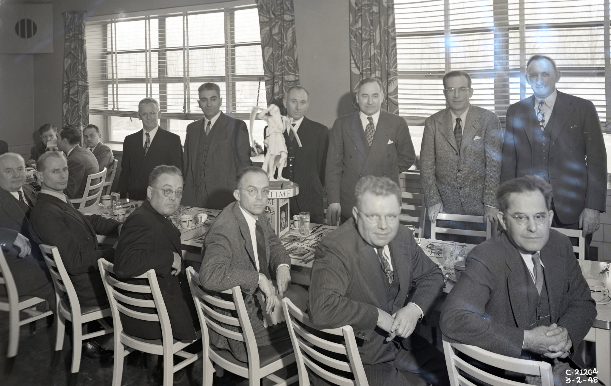 Group sitting at table in cafeteria.