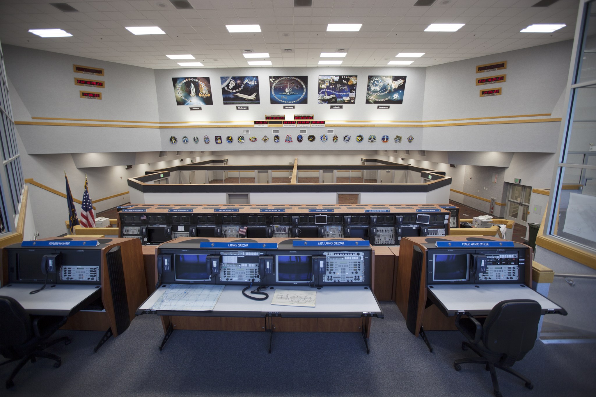 Inside Firing Room 4 in the Launch Control Center at NASA's Kennedy Space Center in Florida, the outer walls, inner walls, windows and doors for the four separate firing rooms on the main floor have been completed. Three rows of upper level management consoles remain and could be used as a fifth firing room.